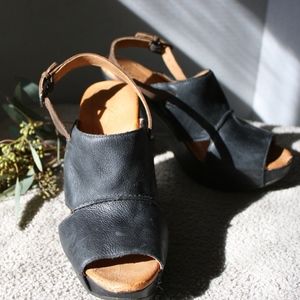 Naya Black Leather Wedges
